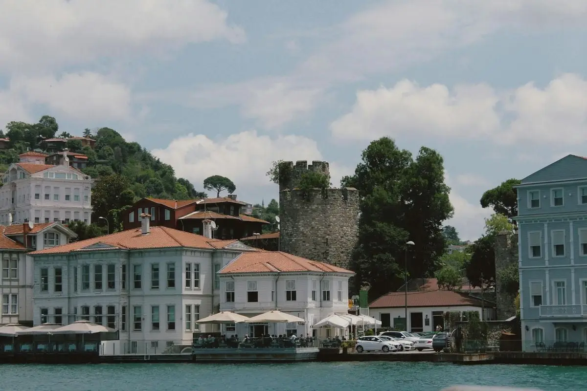 Explore Istanbul's historic waterfront with charming architecture and lush surroundings.