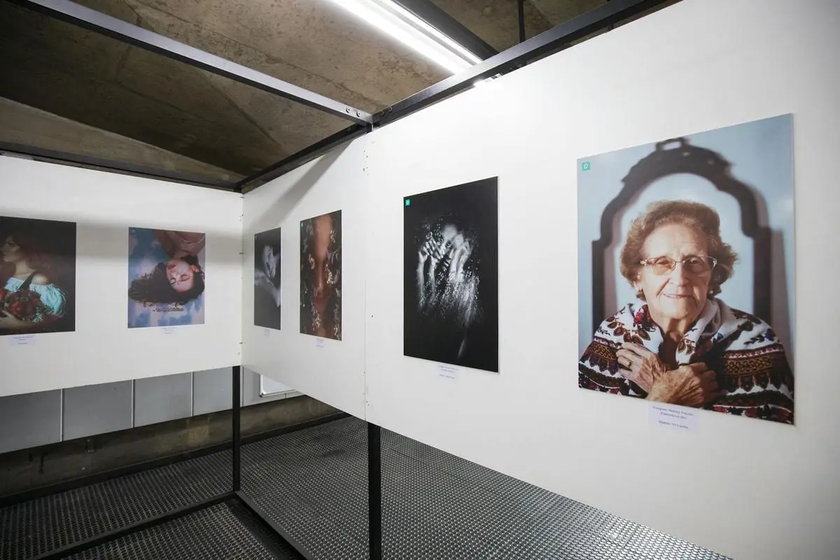 A modern gallery displaying diverse portrait photography, showcasing various artistic expressions.