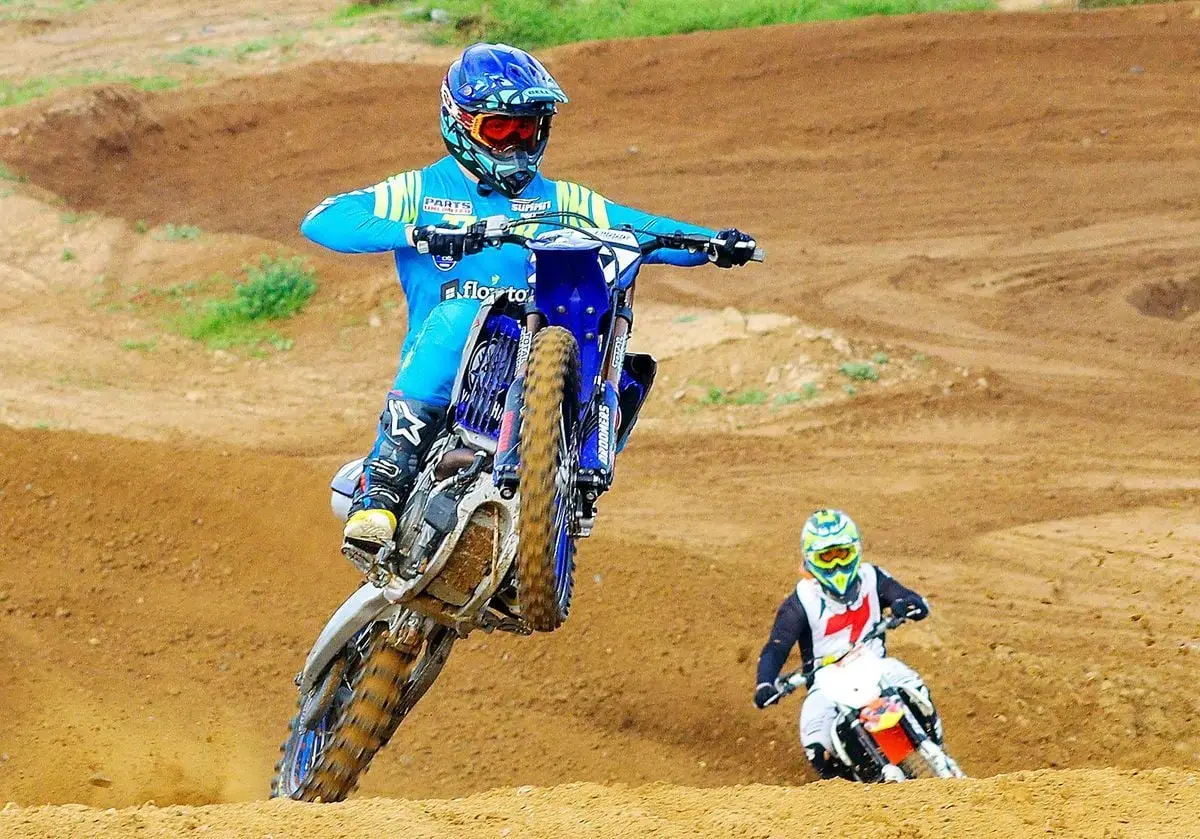 Dynamic motocross race featuring two riders on a track in Cape Town, showcasing speed and skill.