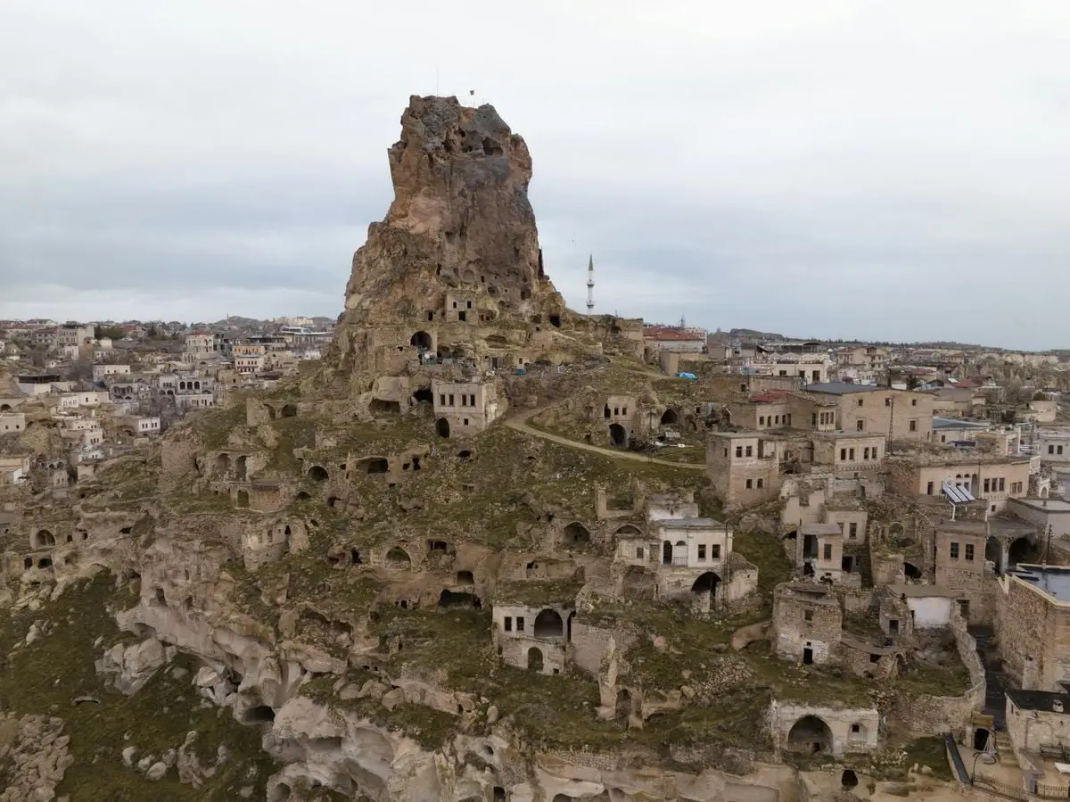 A captivating aerial view of Ortahisar Castle amidst Cappadocia's unique landscape.