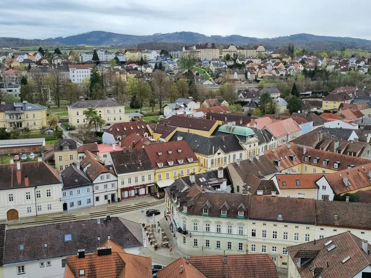 Explore the charming rooftops and landscape of Melk, Lower Austria, from above.