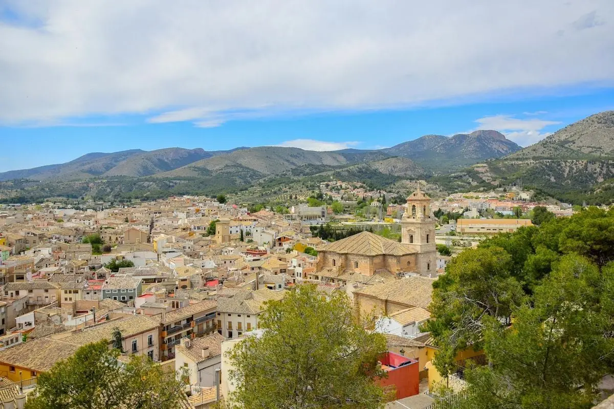 A stunning aerial view of Caravaca de la Cruz showcasing its historic architecture and scenic mountain backdrop.
