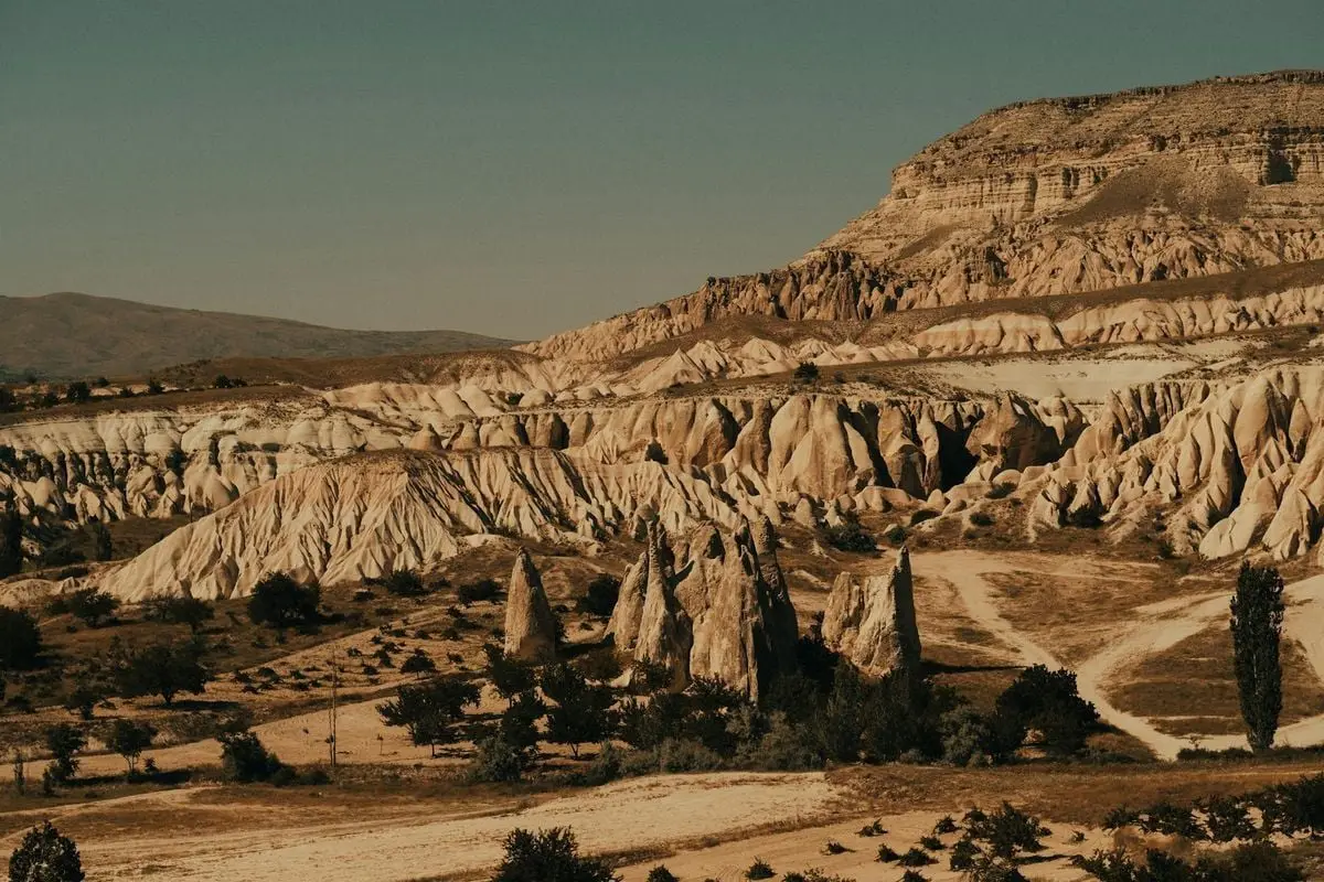 Explore the breathtaking rock formations of Cappadocia, Turkey, a renowned tourist destination.