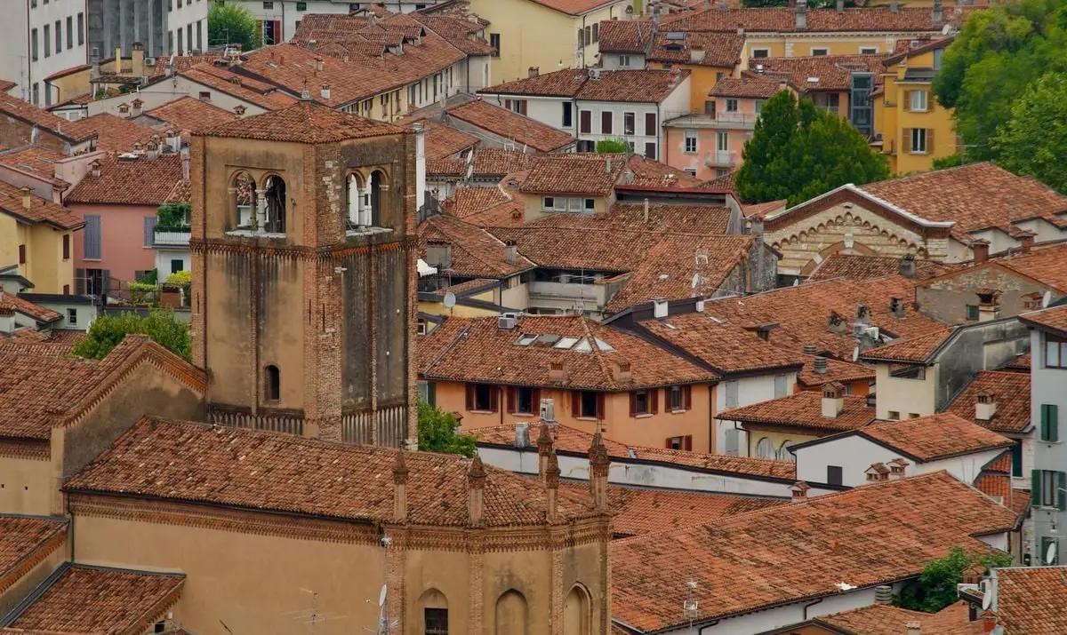 Scenic aerial view of historic Italian rooftops showcasing vibrant terracotta hues.