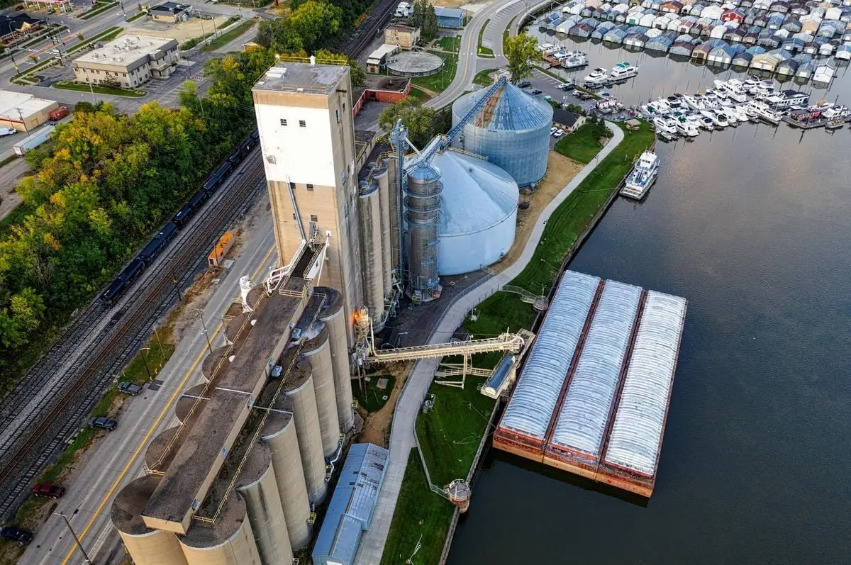 Aerial shot showcasing industrial facilities and a marina in Red Wing, MN during the day.