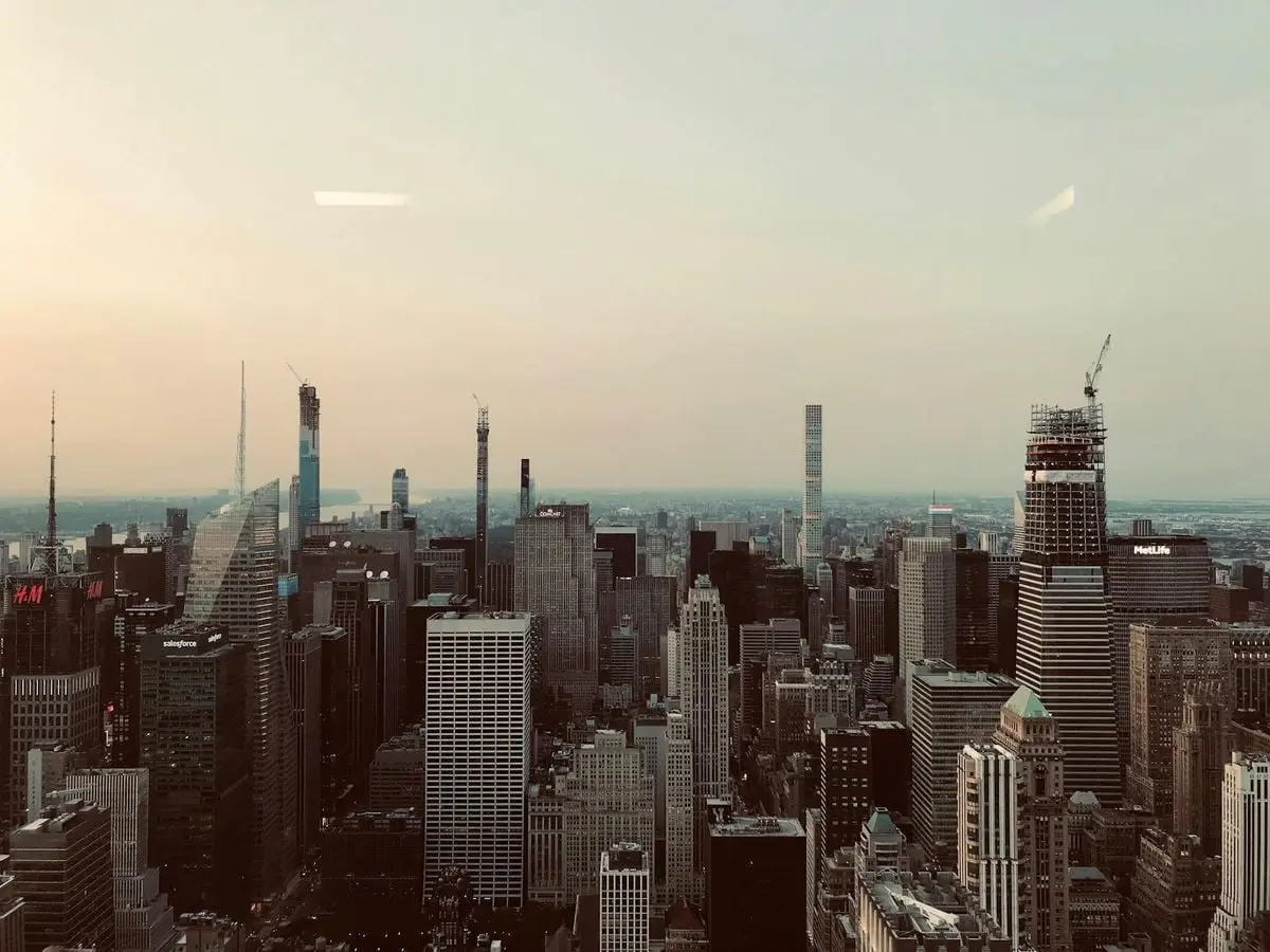 A breathtaking aerial shot of New York City's iconic skyline featuring skyscrapers under a clear sky.