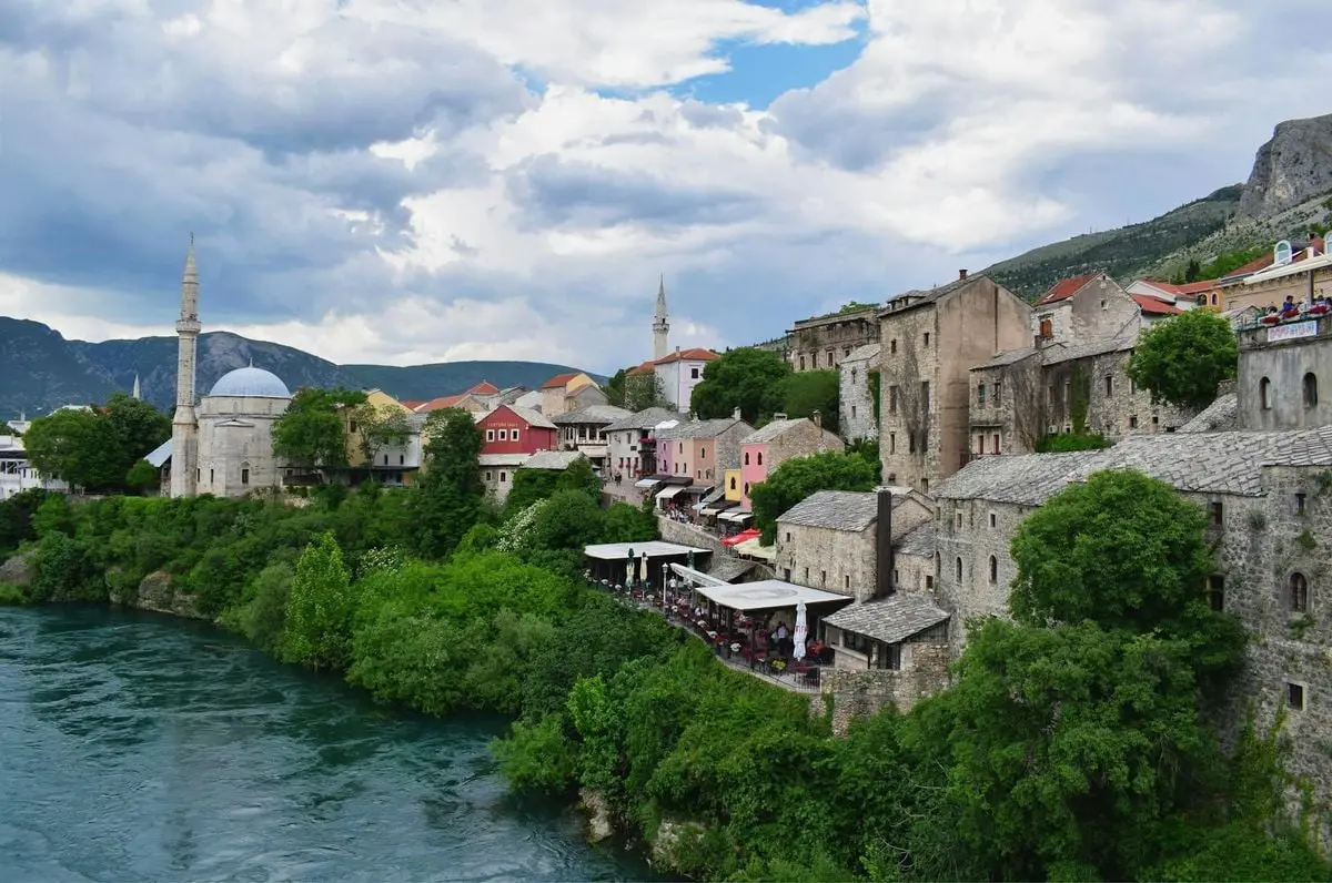 Picturesque view of historic buildings in Mostar, Bosnia and Herzegovina by the river.