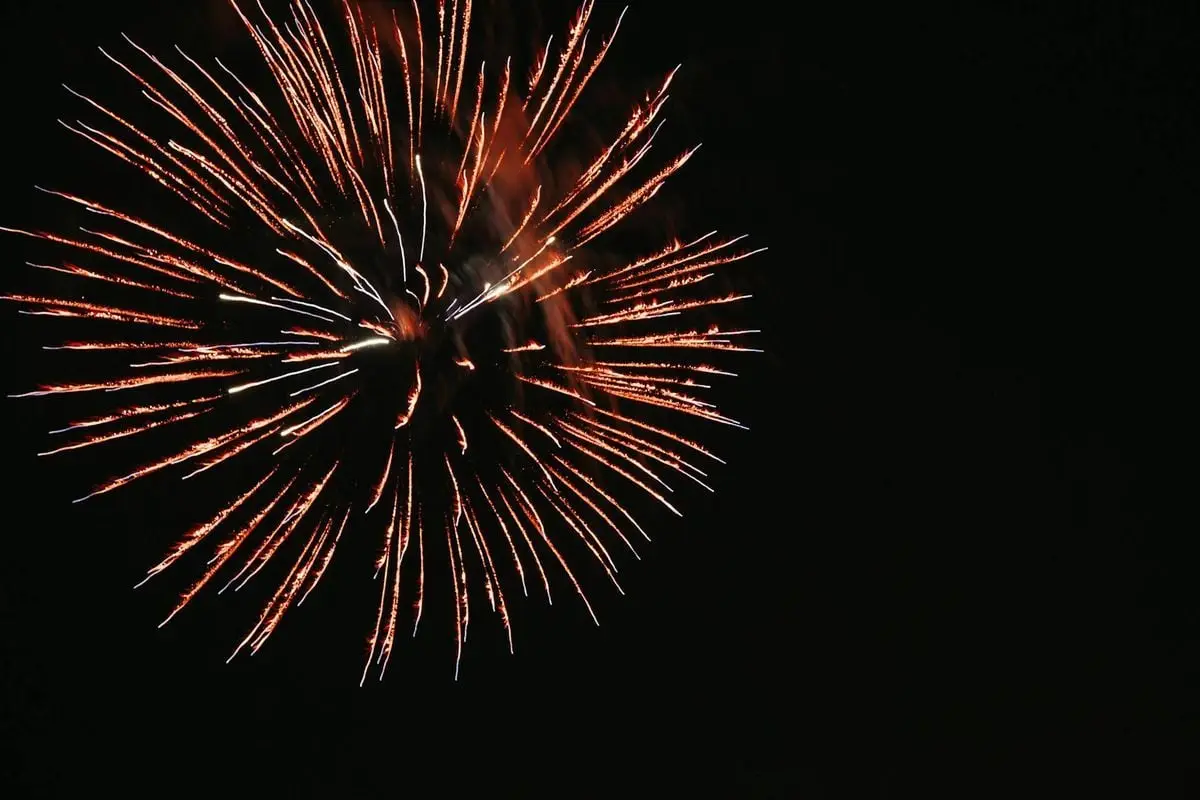 Vibrant fireworks burst against the night sky in Conway, Arkansas.