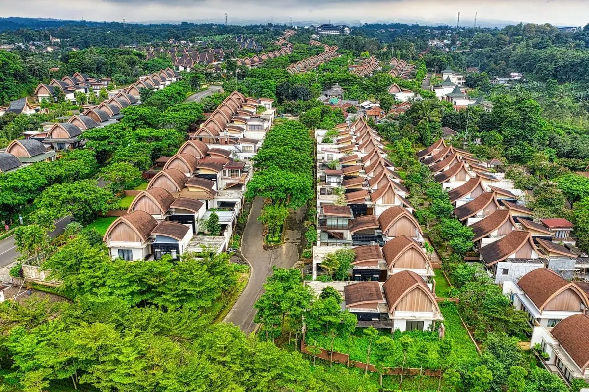 Explore the lush, organized residential area with unique roof designs in West Java, Indonesia.