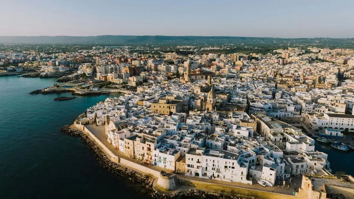 Discover the historic coastal charm of Monopoli with this stunning aerial shot capturing its whitewashed buildings and seaside location.