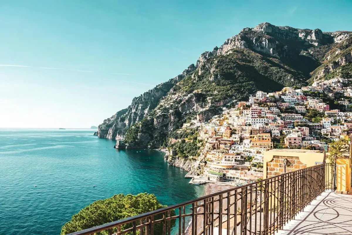 Stunning view of Positano's colorful buildings on the cliffs overlooking the Mediterranean Sea.