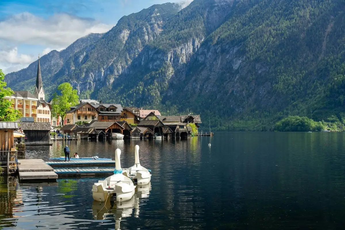 Scenic view of Hallstatt village by the lake with mountains in Upper Austria.