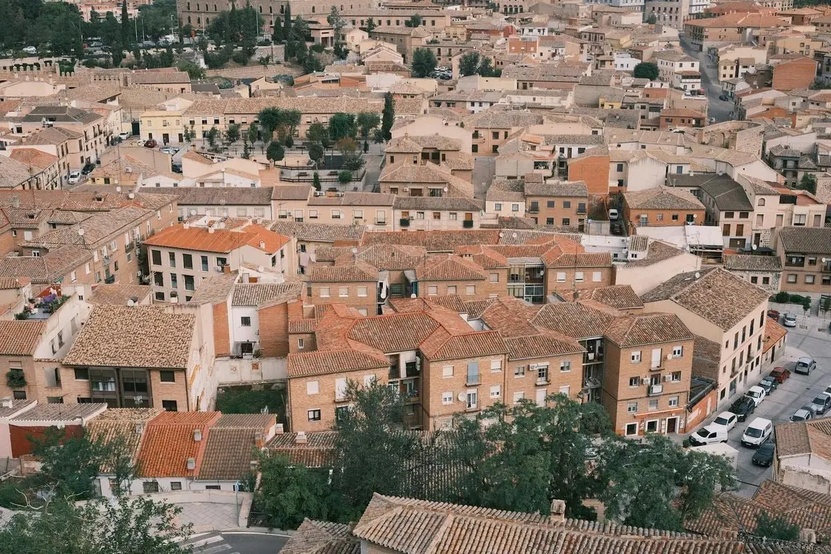 A captivating aerial view of Toledo, Spain showing traditional rooftops and historic architecture.