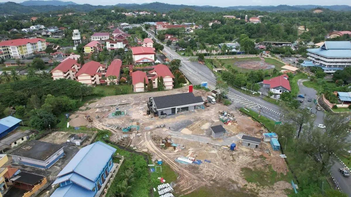 Aerial view showcasing a construction site amidst lush greenery in Marang, Terengganu, Malaysia.