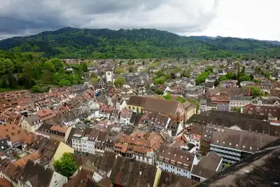 A breathtaking aerial view capturing the charming old town and lush green hills of a historic European village.
