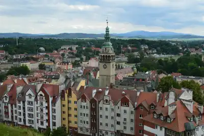 Discover the charming architecture and scenic landscape of Kłodzko, Poland from above.
