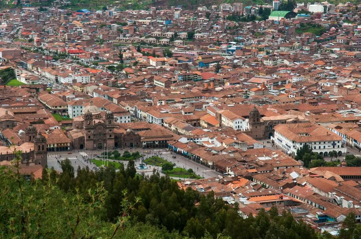 Stunning aerial view of Cusco, Peru showcasing colonial architecture and vibrant city life.