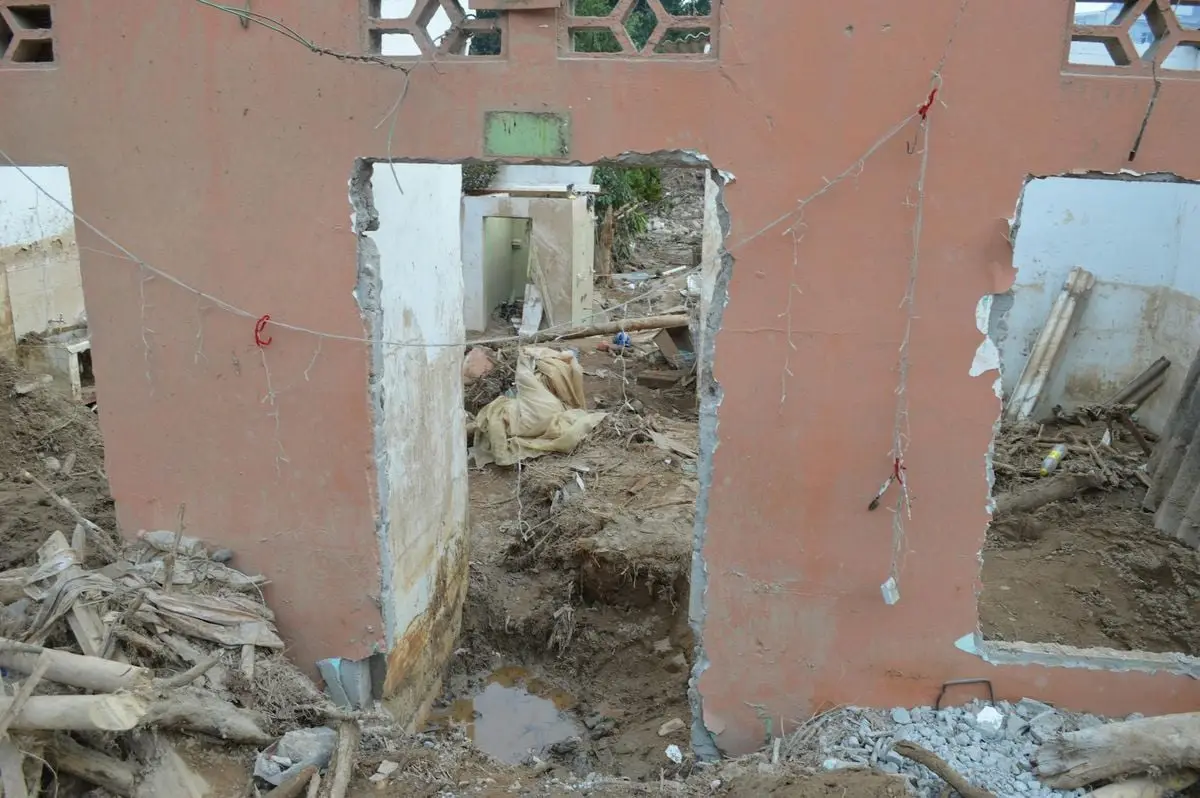 Crumbling walls of an abandoned building in Mocoa, capturing destruction and decay.