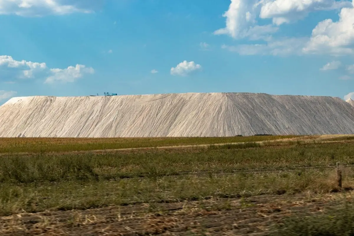 Expansive salt mine landscape with clear blue sky, capturing natural industry outdoors.