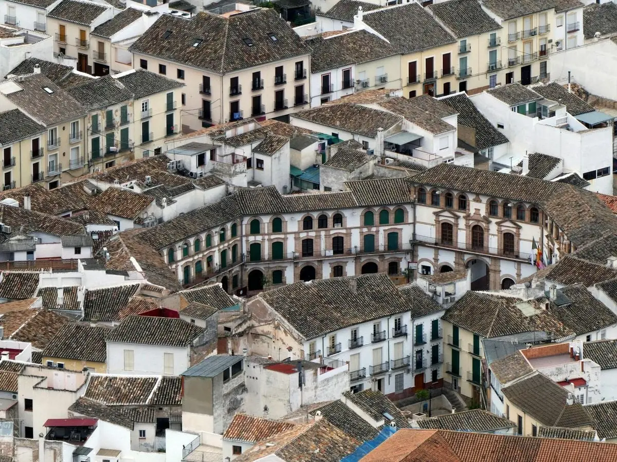 Aerial view of historic Plaza Ochavada surrounded by charming buildings in Archidona, Spain.