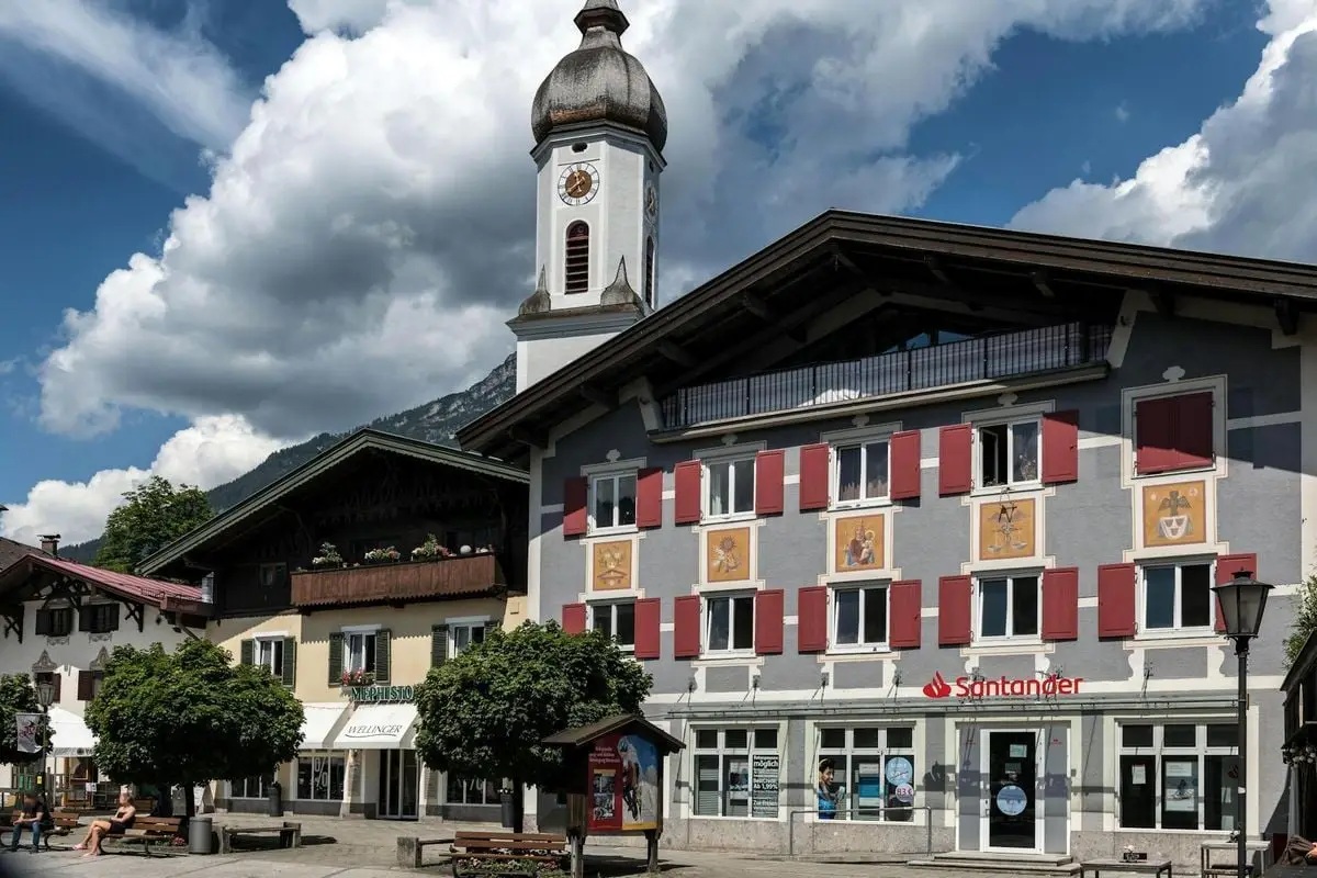 Explore the picturesque Bavarian architecture of Garmisch-Partenkirchen, Germany, with colorful facades and historic charm.
