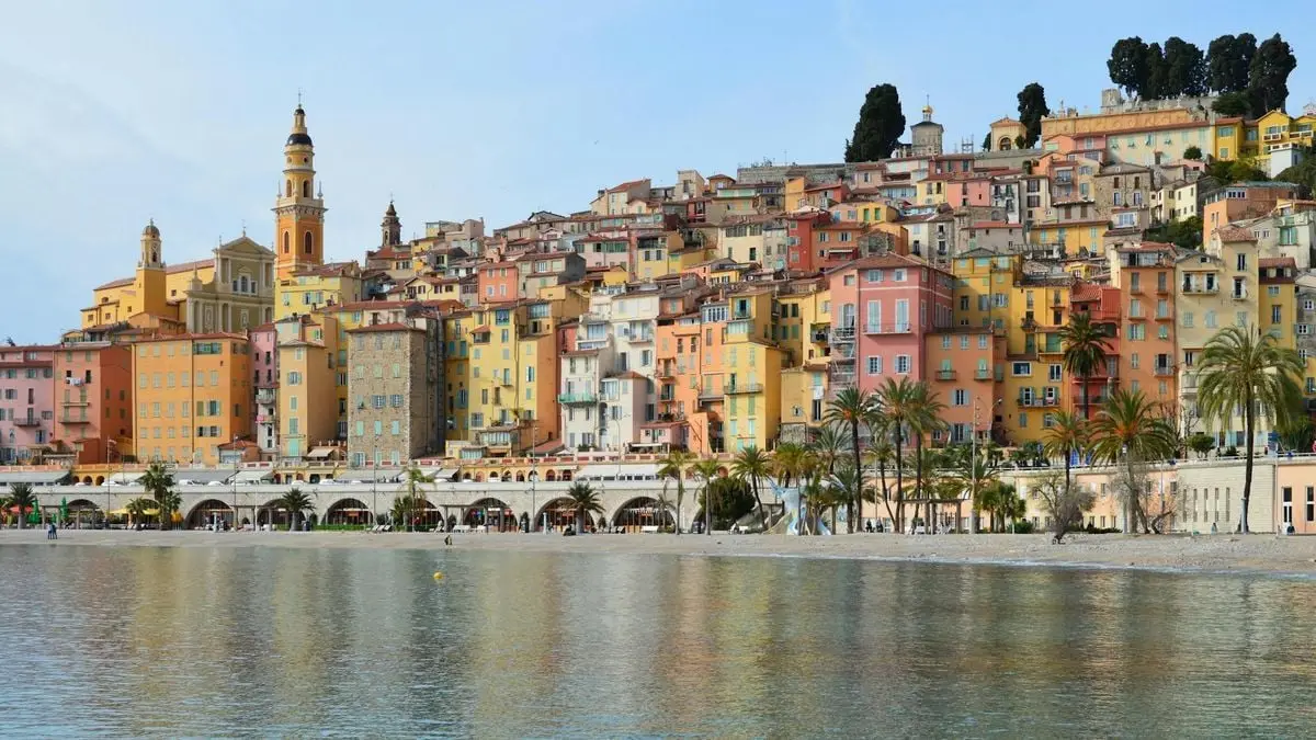 Charming Mediterranean coastal town with colorful buildings and a serene sea view.