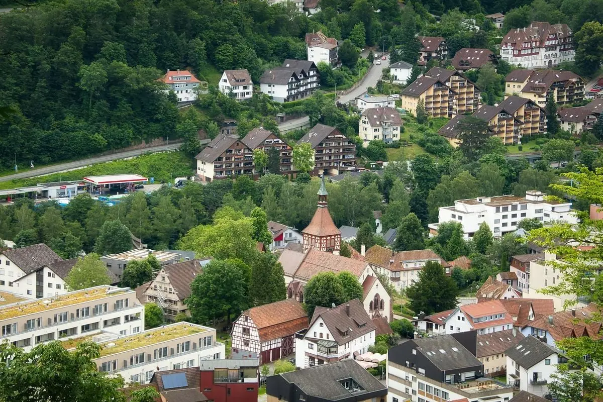 Discover the picturesque town of Bad Liebenzell, capturing its lush greenery and quaint architecture from an aerial perspective.