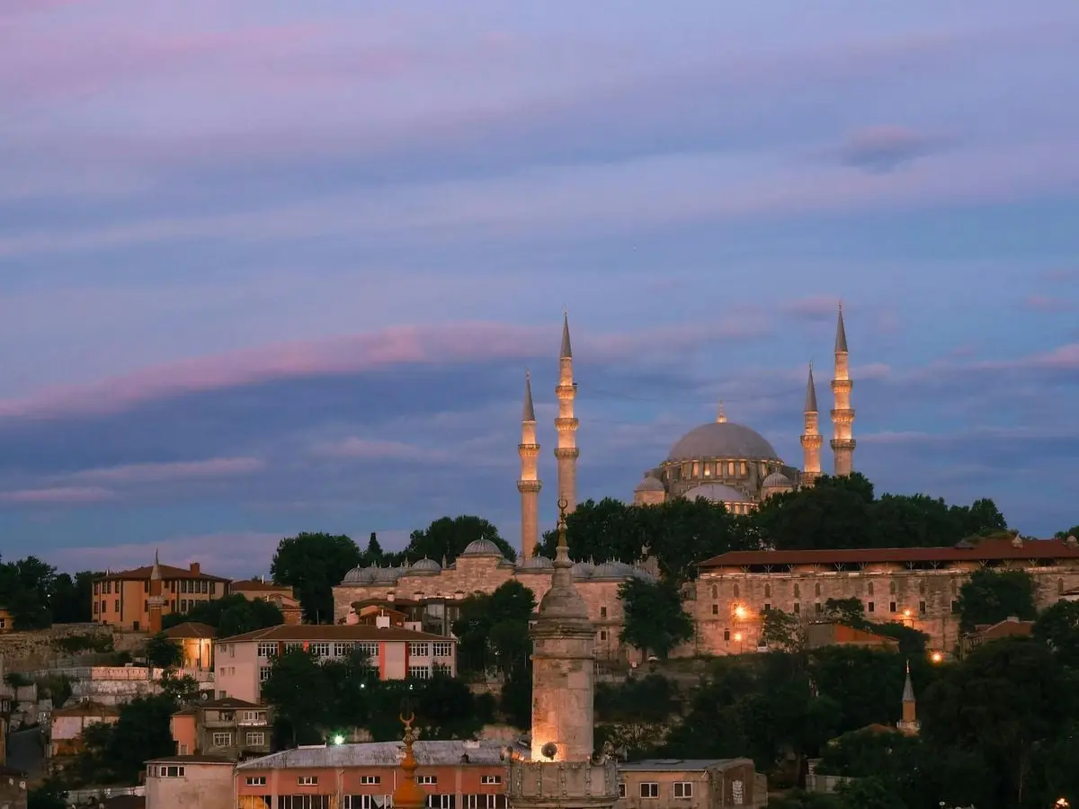 Beautiful view of the Suleymaniye Mosque in Istanbul during twilight with vibrant sky.