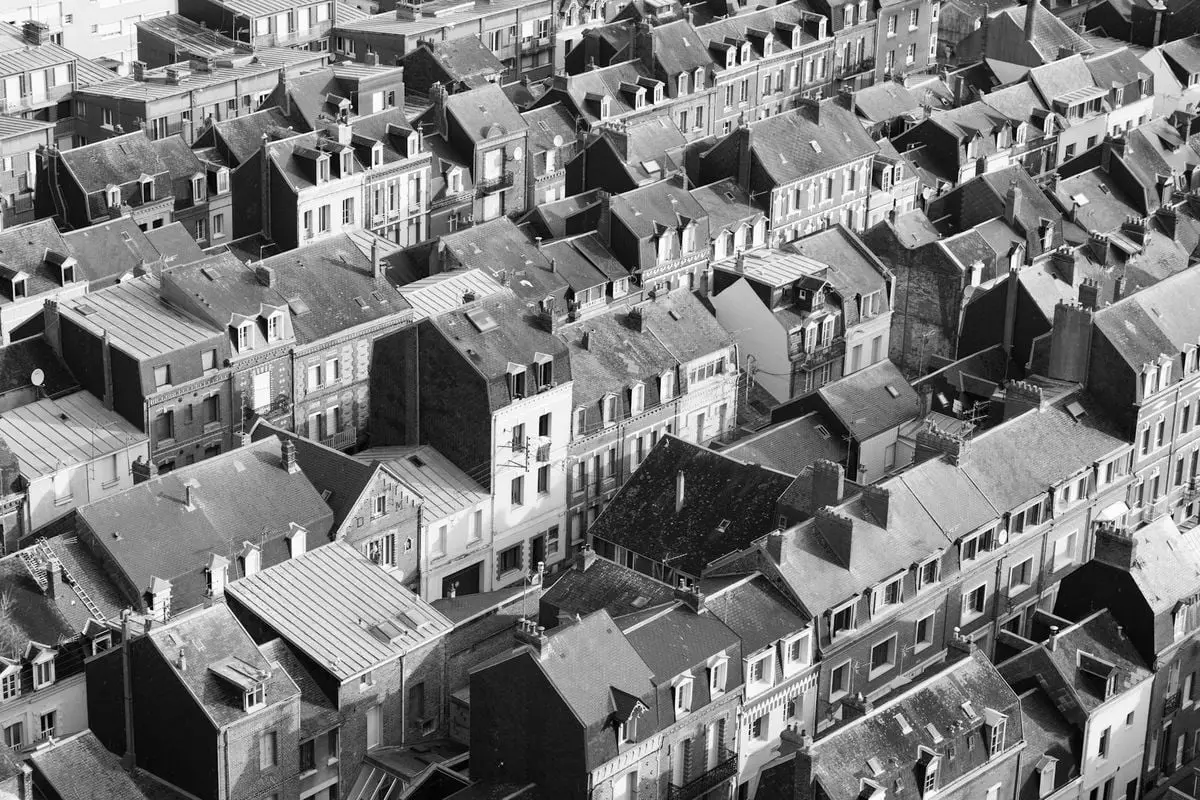 Black and white aerial photo of rooftops in Le Tréport, Normandy, France.