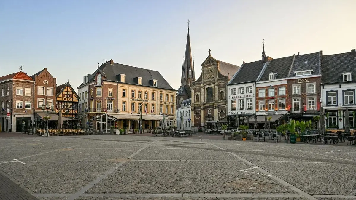 Charming view of historic buildings in Sittard's town square, Limburg, Netherlands.