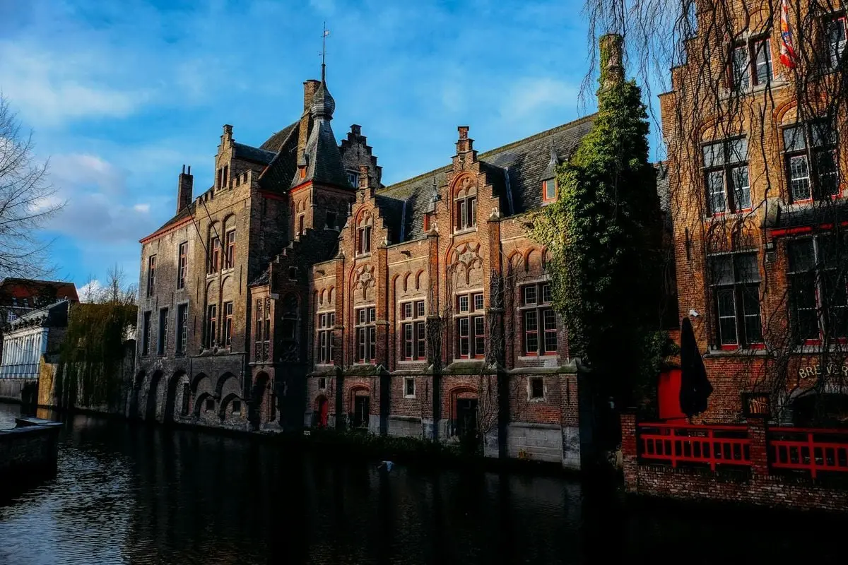 Scenic view of Gothic buildings along a canal in Bruges, Belgium.