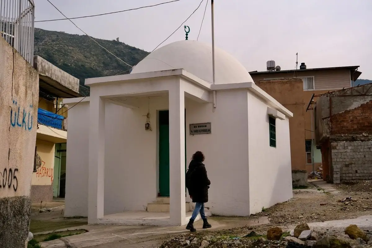 A small white dome shrine in a village depicts Islamic architecture in Antakya.