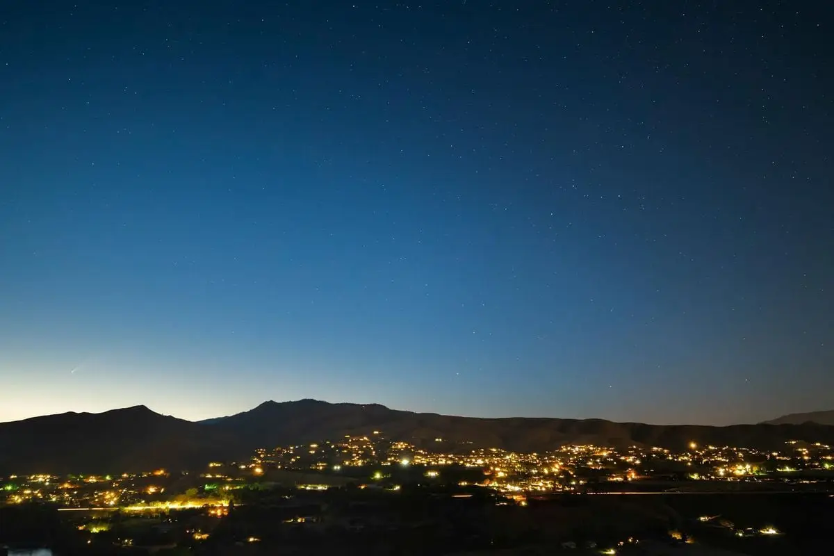Explore the serene night view of Wenatchee's skyline, set against a clear, starry sky.
