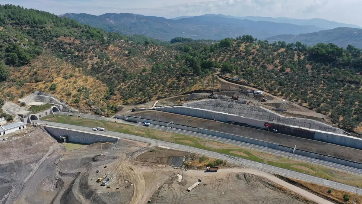 Aerial view of road construction in Küçükçetmi, Çanakkale, Turkey amidst the scenic hills.