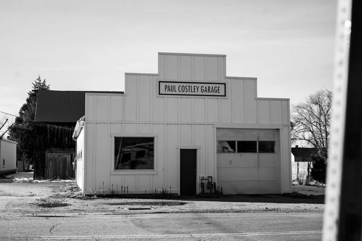 Monochrome image showcasing the nostalgic architecture of Paul Costley Garage.