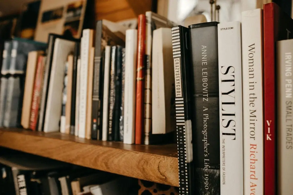 A cozy bookshelf setting showcasing assorted hardcover books emphasizing literature and knowledge.