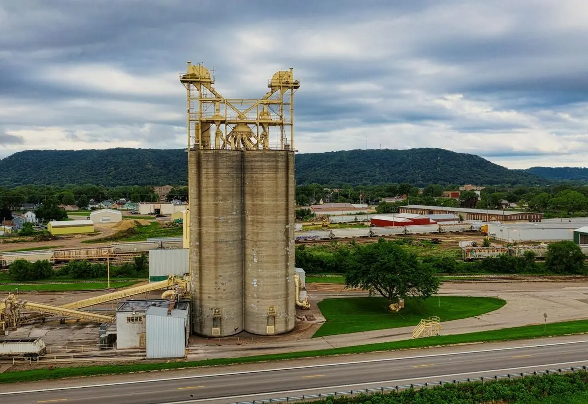 Aerial view of an industrial site with surrounding landscape in Winona, Minnesota.