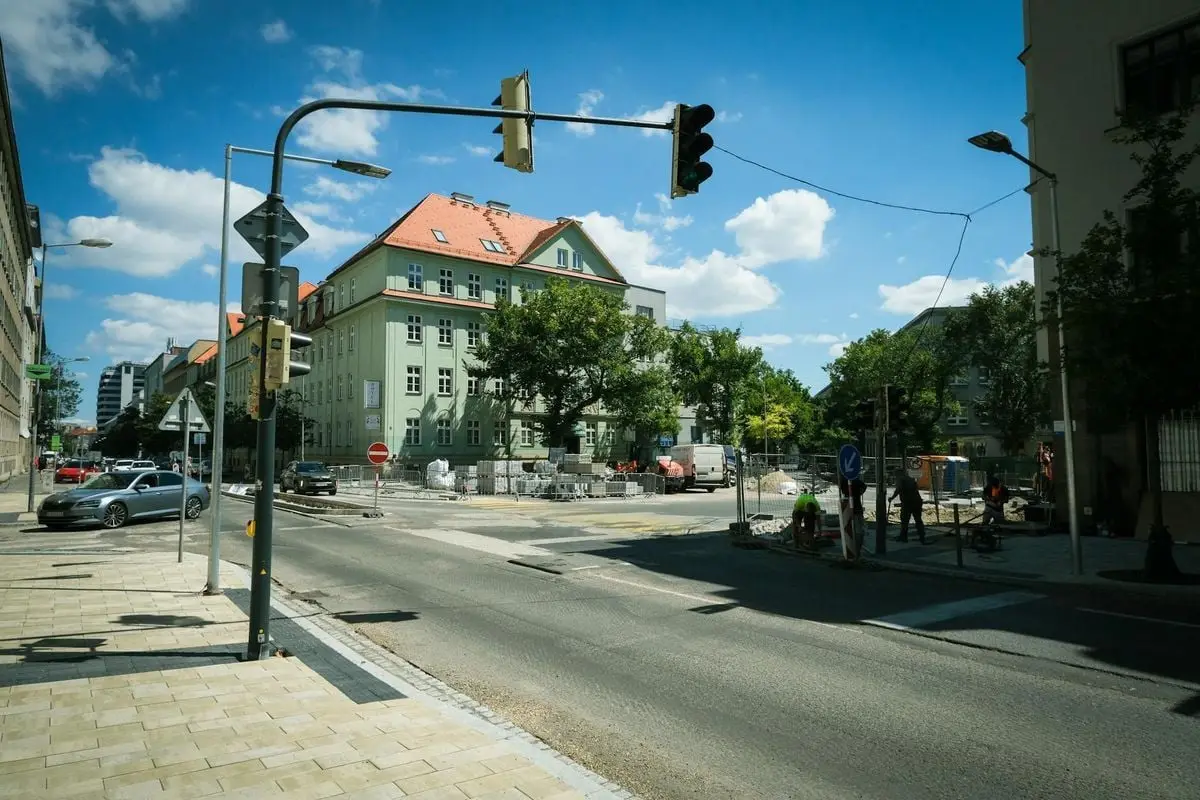 Street construction site in Bratislava, Slovakia featuring historical buildings and traffic.