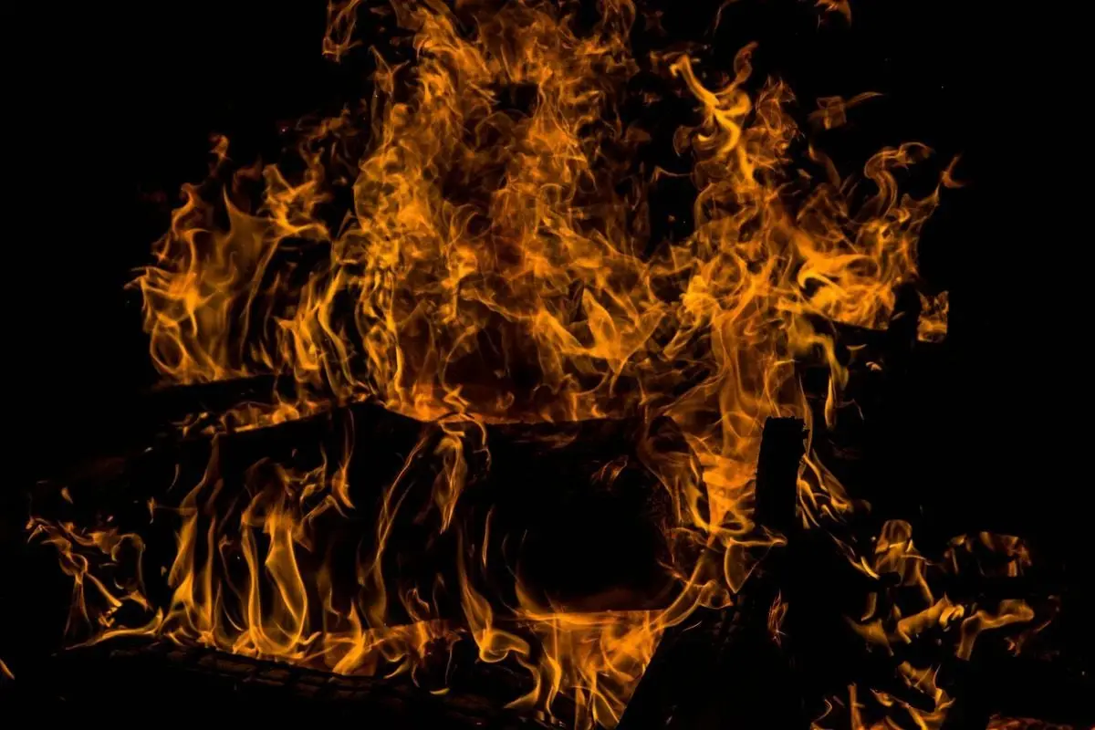 Captivating image of blazing flames against a dark background, highlighting fiery textures.