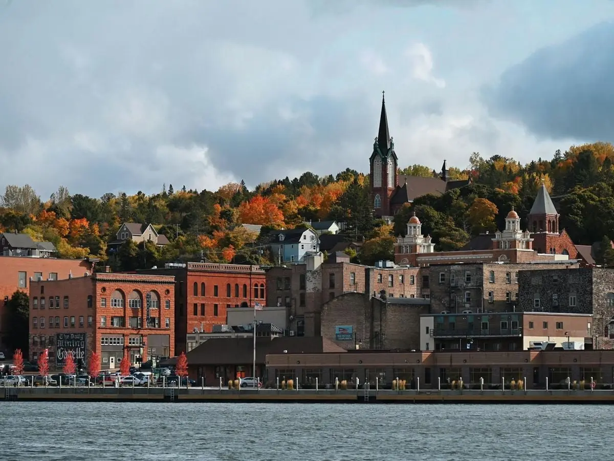 Charming downtown Duluth with fall foliage and historic buildings along the lakeshore.