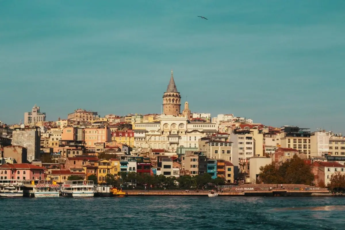 Beautiful view of Galata Tower and vibrant Istanbul skyline by the Bosphorus.