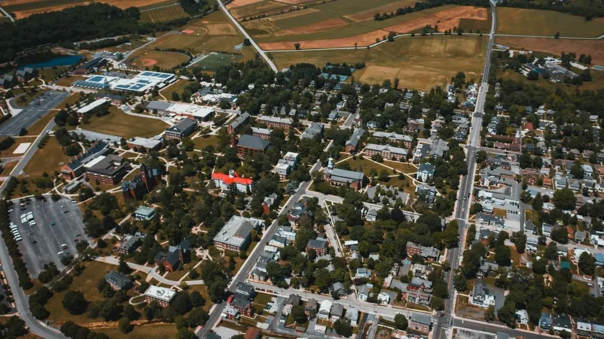 Aerial view of a suburban area in Gettysburg, PA showcasing houses, roads, and greenery.