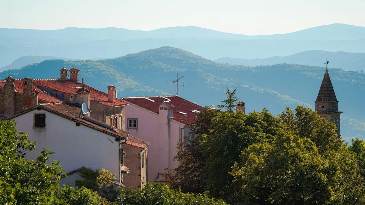Charming architectural landscape of Motovun, Istria with scenic hills and vibrant greenery.