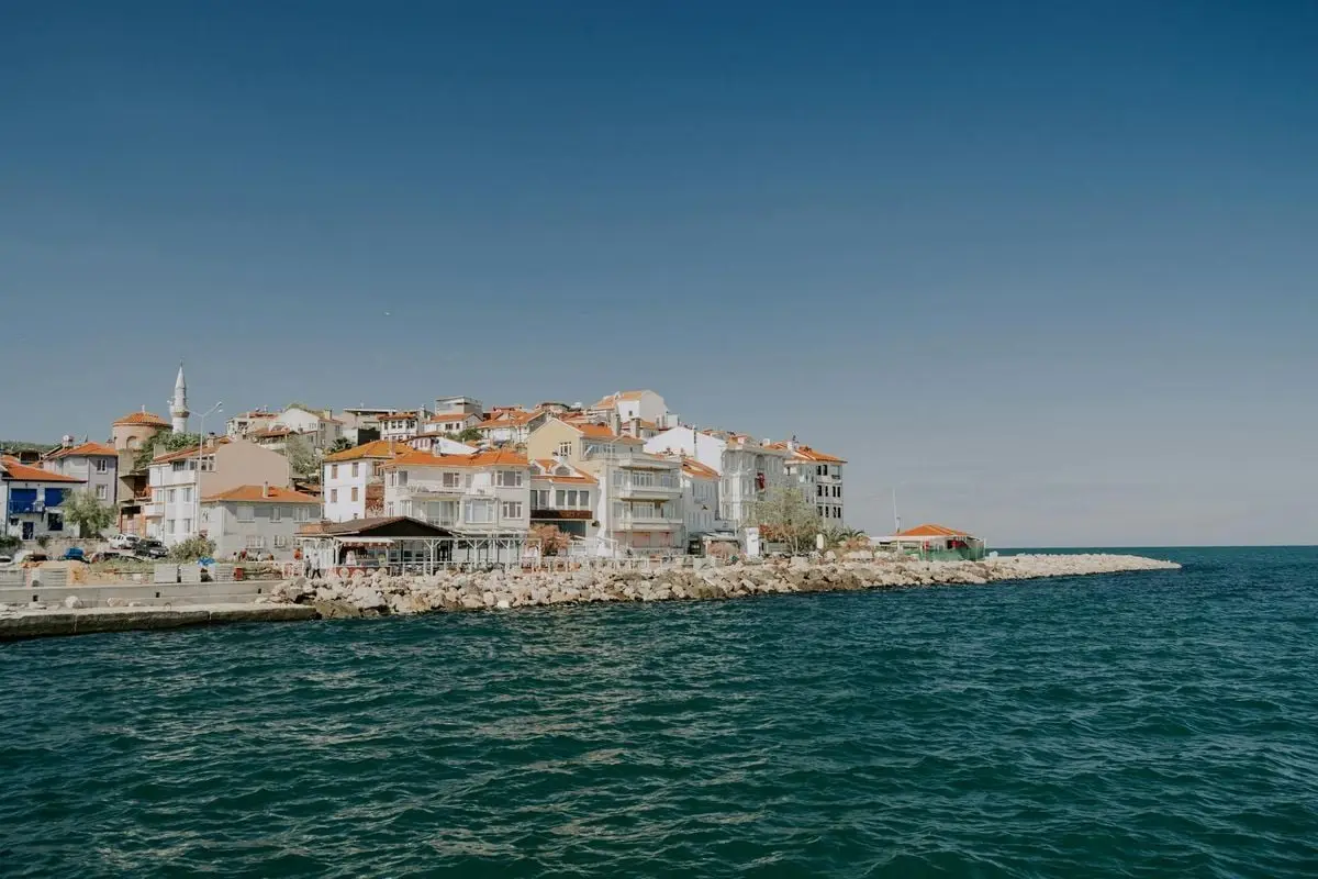 Scenic view of a coastal town with Mediterranean architecture by the sea.