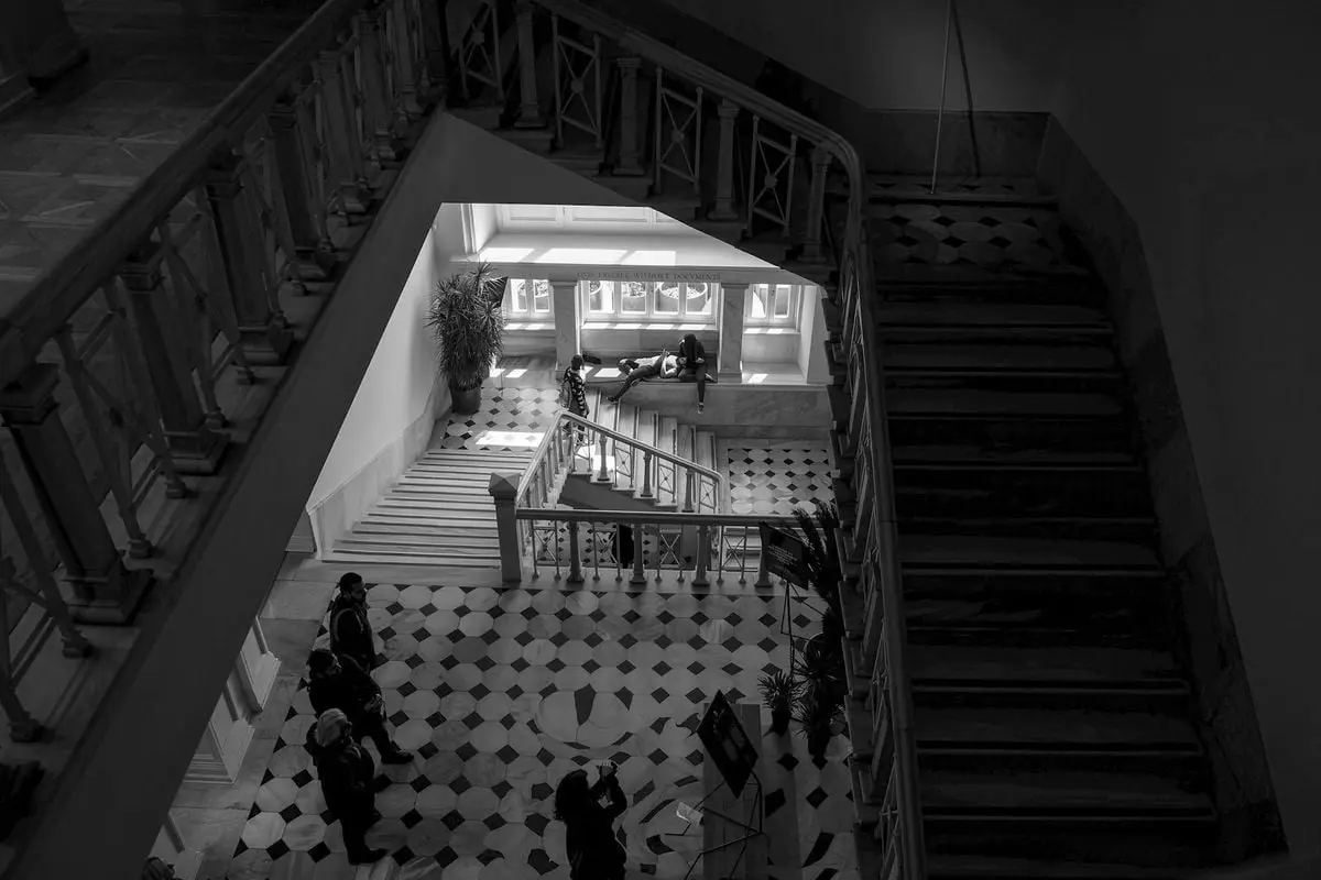 A striking black and white image of a museum interior staircase in İstanbul.