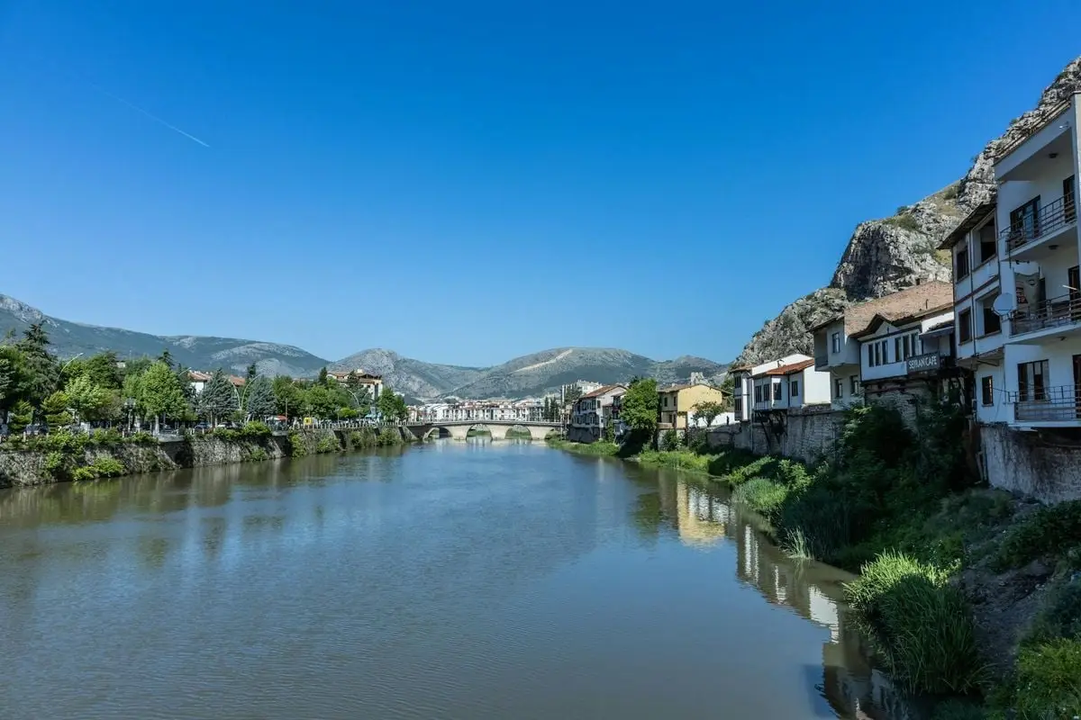 Beautiful river landscape with historic houses and mountains in Amasya, Turkey.