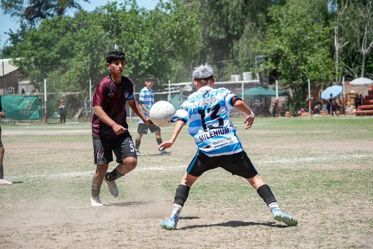 Dynamic youth soccer match outdoors with players in action.