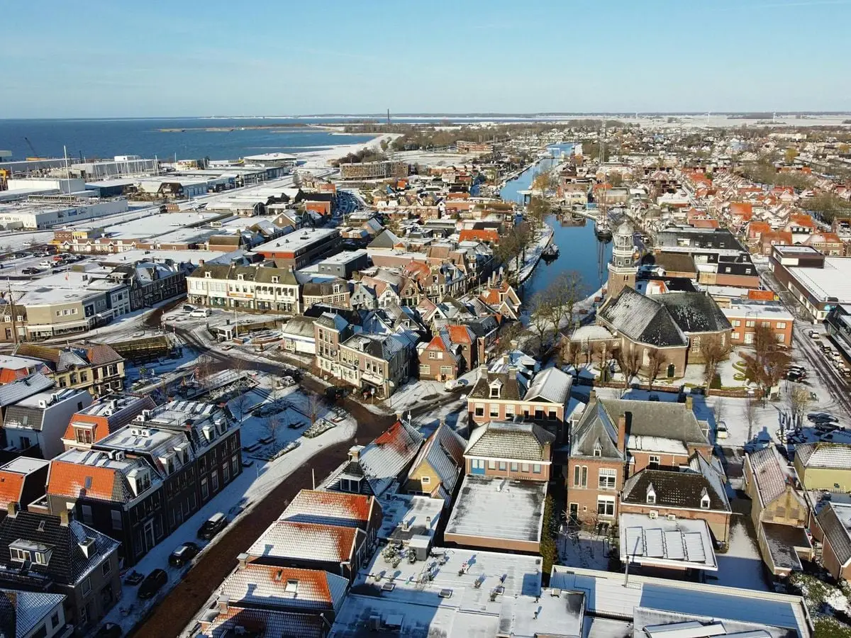 Snow-covered aerial view of the charming city of Lemmer in Friesland, Netherlands.