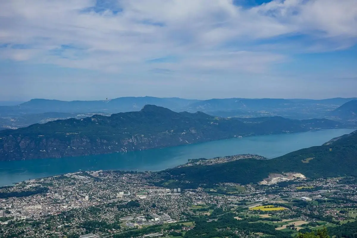 Stunning aerial photography capturing Mont Revard, lake and town in Savoie, France.