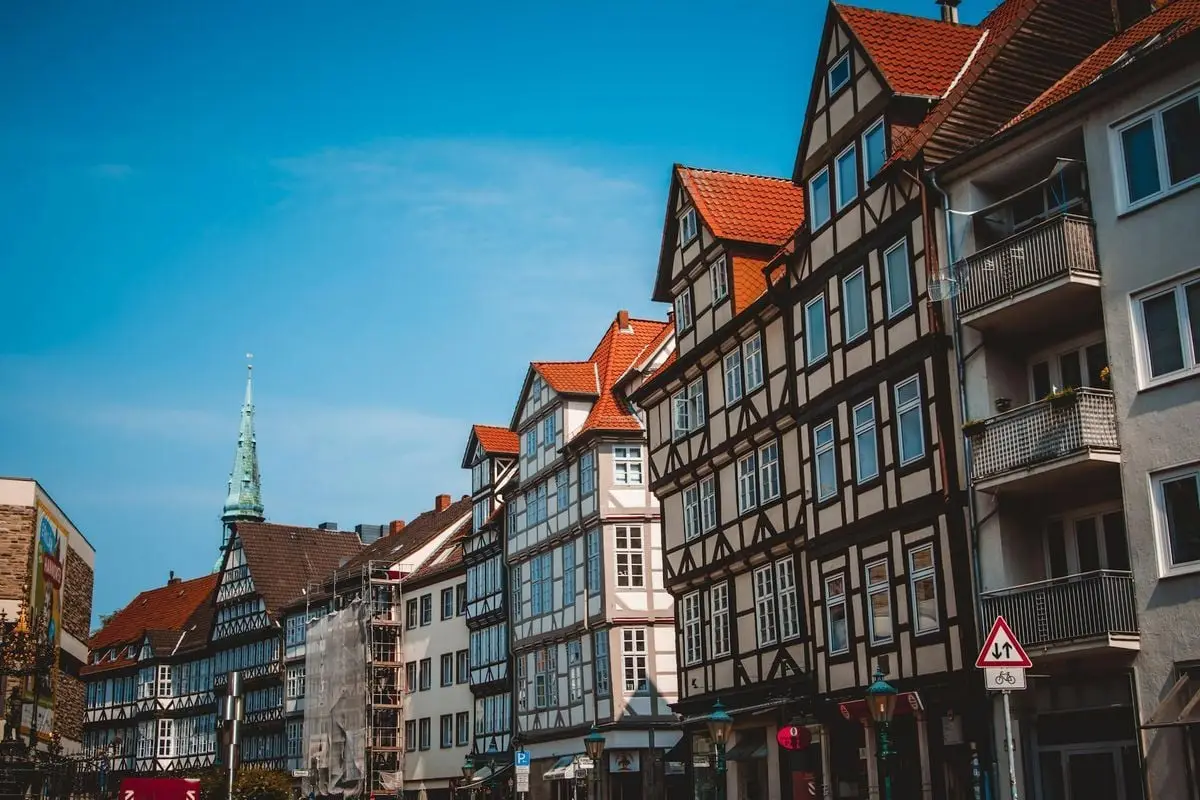 Scenic view of traditional half-timbered houses on a sunny day in Hanover, Germany.